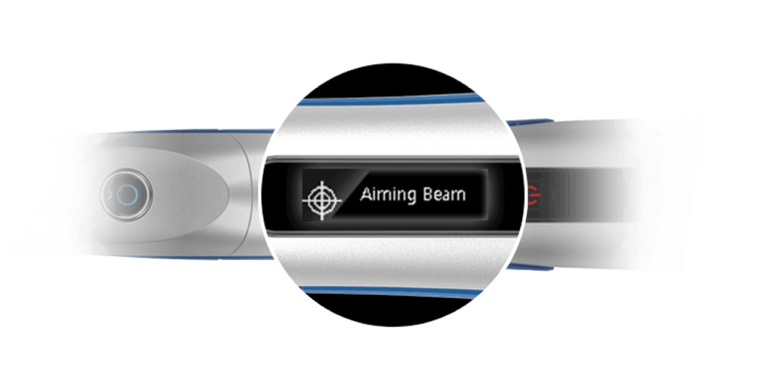 A close up of the aiming beam button